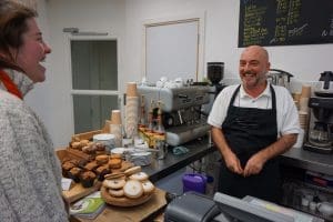 Cafe Supervisor John Scally jokes with a customer